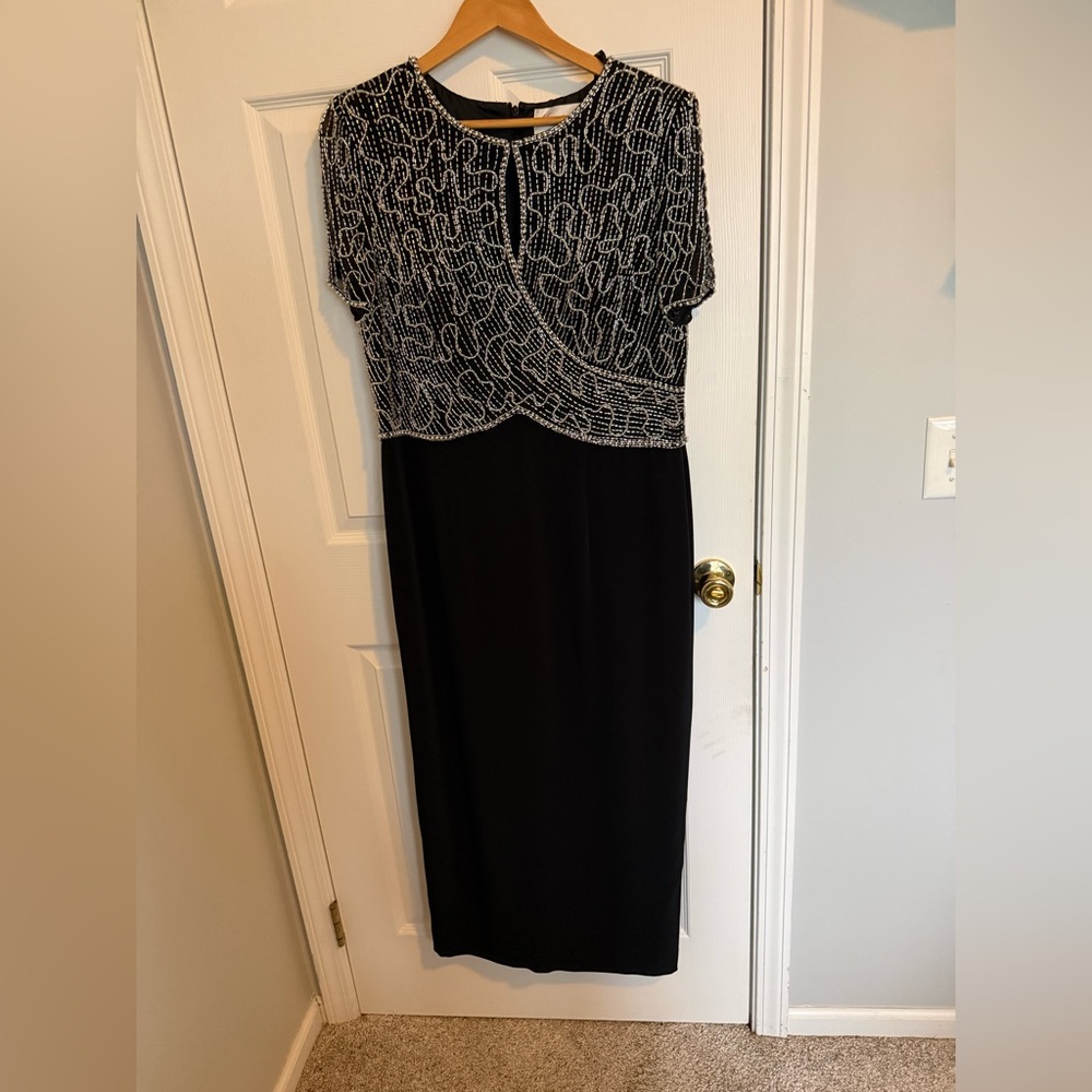 Elegant Black and silver beaded gown. With slit in back
